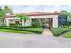 Well-maintained recreation center with lush landscaping, providing a welcoming entrance to the community amenities at 3455 Countryside Blvd # 31, Clearwater, FL 33761