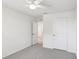 Bedroom with a ceiling fan, and an open doorway leading to more living space at 36557 Night Strawberry Ct, Dade City, FL 33525