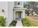 Inviting, arched front entryway framed with landscaping at 36557 Night Strawberry Ct, Dade City, FL 33525