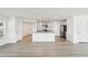 Open-concept kitchen featuring gray cabinets, granite countertops, and stainless steel appliances at 36557 Night Strawberry Ct, Dade City, FL 33525