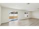 Bright living room with sliding glass doors to backyard at 36557 Night Strawberry Ct, Dade City, FL 33525