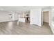 Open living space showcasing kitchen and dining areas, flooded with natural light at 36557 Night Strawberry Ct, Dade City, FL 33525