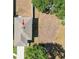 Aerial view of a house roof, illustrating a newly installed roof and chimney at 36557 Night Strawberry Ct, Dade City, FL 33525