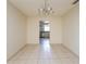 Bright dining room showcasing tile flooring and open access to the kitchen at 3719 Greenford St, Valrico, FL 33596