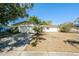 Charming single-story home featuring a two-car garage and well-lit driveway at 3719 Greenford St, Valrico, FL 33596