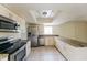 Modern kitchen with stainless steel appliances and white cabinets at 3719 Greenford St, Valrico, FL 33596