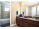 Bathroom with a double vanity, granite countertops, and tiled shower/tub at 4407 Scarlet Loop, Wesley Chapel, FL 33544