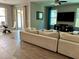 Open-concept living space with combined living and dining areas and tile and wood flooring at 4407 Scarlet Loop, Wesley Chapel, FL 33544