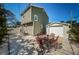The backyard features a patio, the main house, the detached garage and privacy fence at 451 27Th N Ave, St Petersburg, FL 33704
