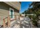 Backyard door with stairs and landing, alongside a patio with tropical landscaping and a privacy fence at 451 27Th N Ave, St Petersburg, FL 33704