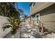 Backyard area features a patio area, tropical landscaping and provides access to the home's back door at 451 27Th N Ave, St Petersburg, FL 33704