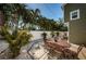 Outdoor patio with ample seating, privacy fence, tropical landscaping, and access to the main house at 451 27Th N Ave, St Petersburg, FL 33704