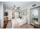 Cozy bedroom featuring neutral paint, hardwood floors, ceiling fan, and closet with barn door at 451 27Th N Ave, St Petersburg, FL 33704