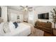 Bright bedroom featuring hardwood floors, ceiling fan, and a cozy, inviting bed at 451 27Th N Ave, St Petersburg, FL 33704