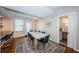 Dining room with a modern table and rug, with access to the kitchen and bathroom at 451 27Th N Ave, St Petersburg, FL 33704