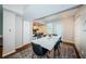 Open concept dining room features a long table and view to the kitchen with hardwood floors at 451 27Th N Ave, St Petersburg, FL 33704