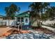 Charming home featuring a lush front yard, inviting porch, and well-maintained exterior at 451 27Th N Ave, St Petersburg, FL 33704