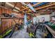Unfinished garage area features wood beams, a water heater, and extra storage for tools and equipment at 451 27Th N Ave, St Petersburg, FL 33704
