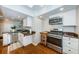 Modern kitchen with stainless steel appliances, granite countertops, and ample cabinet space at 451 27Th N Ave, St Petersburg, FL 33704