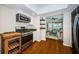 Cozy kitchen features stainless steel appliances and leads into the living room with a butcher block island at 451 27Th N Ave, St Petersburg, FL 33704