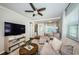 Cozy living room with hardwood floors, comfortable seating, and an entertainment center at 451 27Th N Ave, St Petersburg, FL 33704