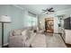 Spacious living area with a plush couch, natural light, and open layout to other rooms at 451 27Th N Ave, St Petersburg, FL 33704