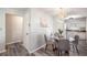 Cozy dining area next to a modern kitchen with a glass table and gray chairs at 4516 W Paxton Ave, Tampa, FL 33611