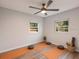 This studio has a ceiling fan, yoga mats and windows at 4516 W Paxton Ave, Tampa, FL 33611