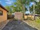 Backyard features a storage shed and well-maintained landscaping at 4519 Swallowtail Dr, New Port Richey, FL 34653