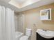 Bathroom featuring sink vanity, toilet, and shower with curtain at 4519 Swallowtail Dr, New Port Richey, FL 34653