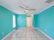 Bedroom with tile floors, bright walls, and a modern ceiling fan for comfort at 4519 Swallowtail Dr, New Port Richey, FL 34653