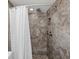 Tiled shower stall showcasing updated fixtures and design at 4519 Swallowtail Dr, New Port Richey, FL 34653