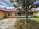 View of the home's sunroom and backyard patio area at 4593 Goldcoast Ave, Spring Hill, FL 34609