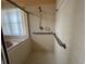 Accessible bathroom with safety bars and glass door shower stall at 4593 Goldcoast Ave, Spring Hill, FL 34609