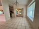 Bright dining area showcases tile floors and sliding glass doors to the porch at 4593 Goldcoast Ave, Spring Hill, FL 34609