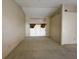 Empty living room with high ceilings and sliding glass doors for optimal light at 4593 Goldcoast Ave, Spring Hill, FL 34609