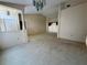 Spacious living room with neutral carpet, high ceilings, and lots of natural light at 4593 Goldcoast Ave, Spring Hill, FL 34609