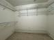 Spacious walk-in closet with ample shelving for optimal storage solutions at 4593 Goldcoast Ave, Spring Hill, FL 34609