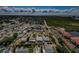 Expansive aerial view of a neighborhood with private pools and a nearby waterfront condo community at 4704 Shale Pl, Tampa, FL 33615