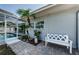Landscaped backyard with a paved patio area and a view of the screened-in pool at 4704 Shale Pl, Tampa, FL 33615