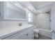 Updated bathroom with vanity, tiled tub, and glass enclosed shower at 4704 Shale Pl, Tampa, FL 33615