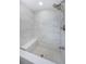 Tiled shower with a built in seat and modern shower head fixture at 4704 Shale Pl, Tampa, FL 33615
