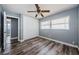 Cozy bedroom with hardwood floors, a ceiling fan, and a closet with double doors at 4704 Shale Pl, Tampa, FL 33615