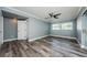 Bedroom with dark hardwood floors, a ceiling fan, and a window at 4704 Shale Pl, Tampa, FL 33615