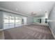 Large bonus room featuring sliding glass doors to the pool and mirrored wall at 4704 Shale Pl, Tampa, FL 33615