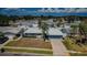 Aerial view of a single Gathering home showing a landscaped yard with a two car garage at 4704 Shale Pl, Tampa, FL 33615