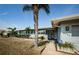 Close up exterior of a single-story home with a lawn and trimmed bushes at 4704 Shale Pl, Tampa, FL 33615