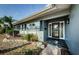 Charming home exterior with a well-maintained lawn, stylish front door, and mature landscaping at 4704 Shale Pl, Tampa, FL 33615