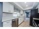 Bright kitchen featuring modern appliances, stylish backsplash, and ample cabinet space for storage and functionality at 4704 Shale Pl, Tampa, FL 33615