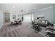 Spacious living room with large windows and neutral decor provides a relaxing atmosphere at 4704 Shale Pl, Tampa, FL 33615